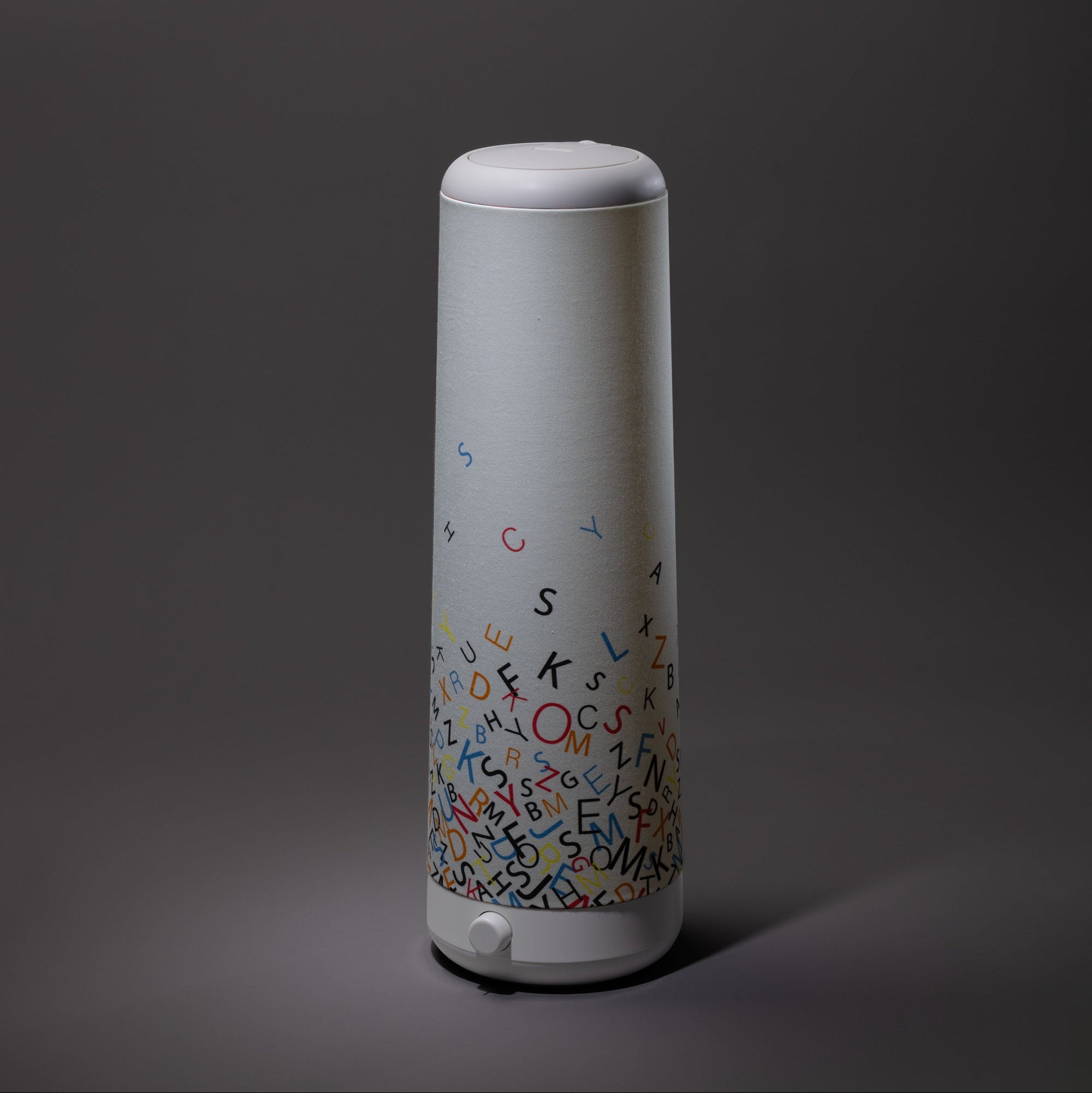 The Alphabet Cascade Cotton Shade by Nightside features colorful alphabet letters on a white cotton surface, bringing playful style to any lamp and adding charm to décor reminiscent of a Nightside ambiance.