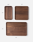 The Ugmonk Valet Tray Bundle features three handcrafted solid walnut trays, each on a white background and labeled with its size: 4.25x7.5”, 7.5x7.5”, and 11.5x7.5”.