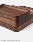 Ugmonk’s Valet Tray Bundle features three handcrafted solid walnut trays in large, medium, and small sizes, stacked on a white background to showcase their smooth edges and rich wood grain.