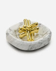 The Craighill Brass Jack Puzzle, made from solid brass, sits elegantly within a Craighill white marble Facet Bowl.