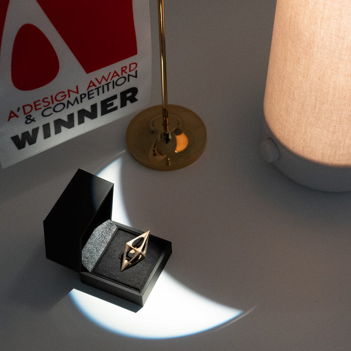 The A'Design award trophy illuminated by a Nightside lamp.