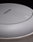 Closeup of the top of a gray Nightside lamp