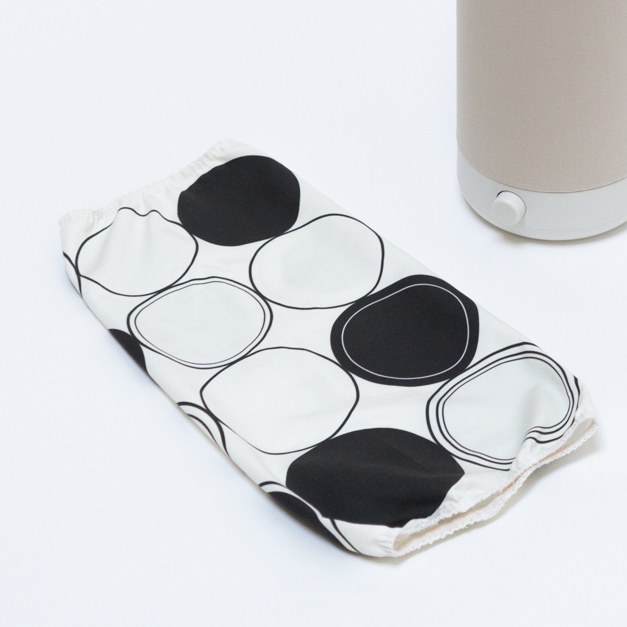 The Nightshade Concentric Circles shade lays next to the Nightside NS01 task lamp on a white table surface.