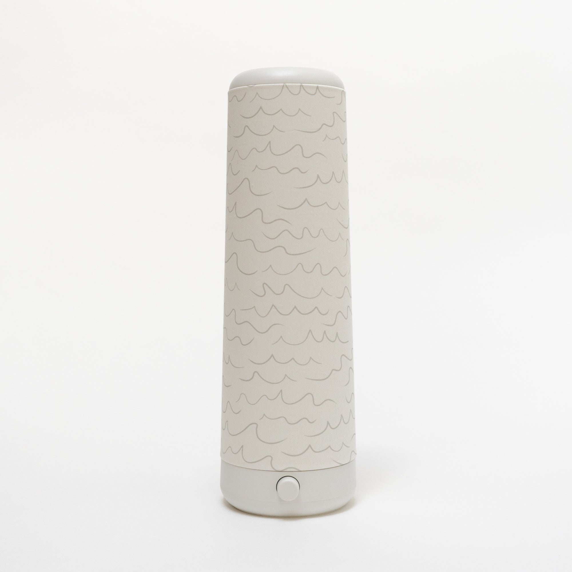 A tall, cylindrical water bottle with a white background features a simple wavy line pattern, a white lid, and a button near the base, showcasing minimalistic elegance reminiscent of the refined design seen in Nightsides Cursive Lines Cotton Shade.