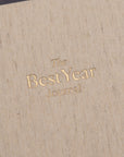 The Best Year Journal by Intelligent Change is a beige fabric-covered planner featuring gold embossed text—ideal for goal setting and organizing your year.