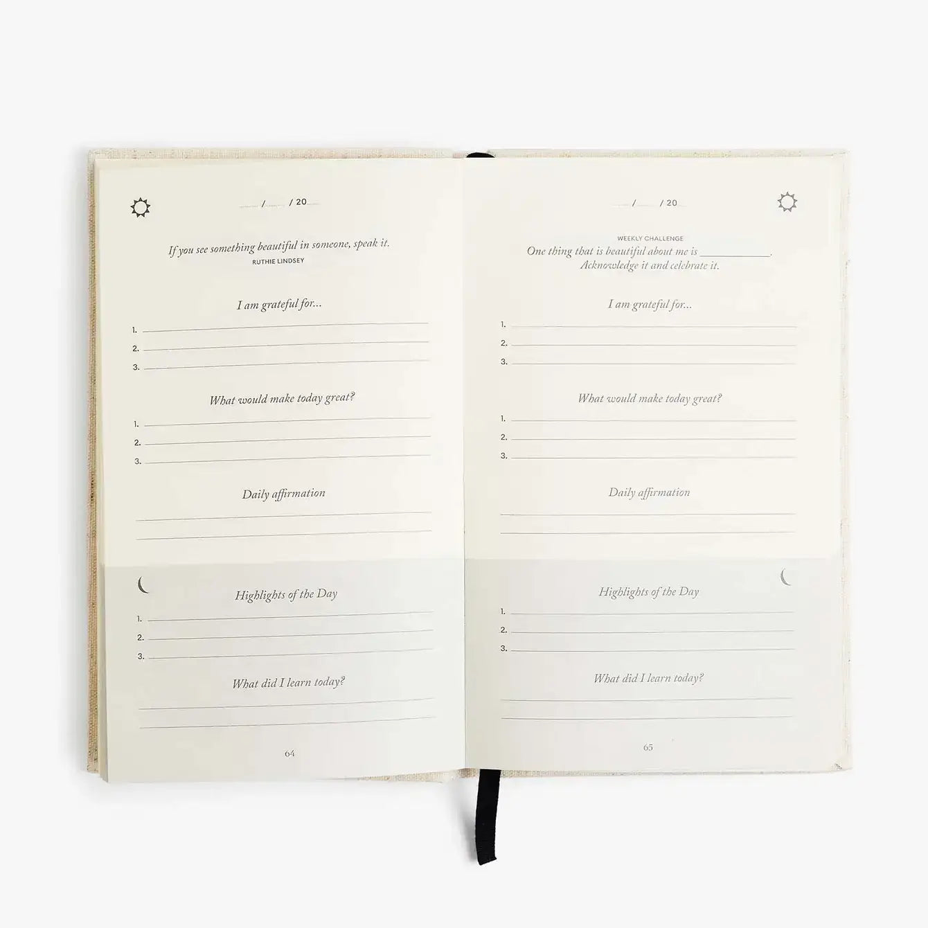 The Five Minute Journal by Intelligent Change lies open, inviting reflection with sections like I am grateful for... and Daily affirmation. This undated planner encourages introspection over 6 months, with a black ribbon bookmark guiding you through its 264 pages.